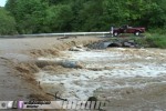 Creek overflows across road