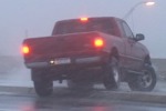 Truck wrecks on icy bridge