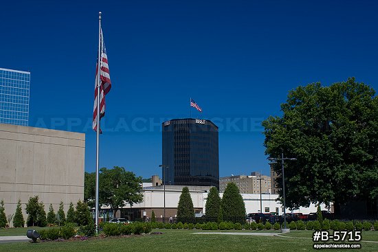 Downtown buildings, flags and blue sky