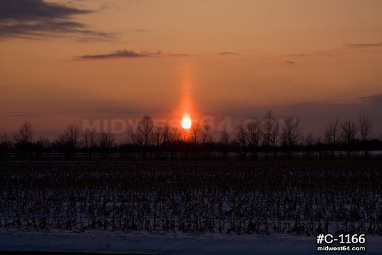 Winter sun pillar at sunset