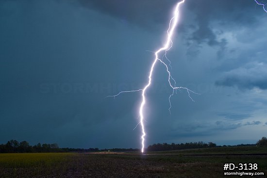 Very close vivid lightning strike in a field at twilight near Terre Haute, Indiana.