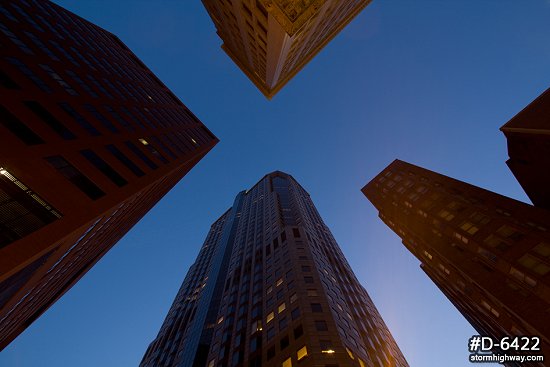 Looking up at skyscrapers at twilight