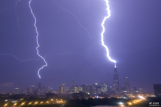 Lightning strikes the Sears (Willis) Tower and John Hancock Center in Chicago, Illinois