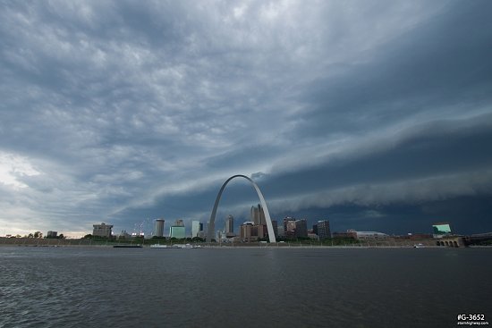 Incoming severe thunderstorm over St. Louis and the Gateway Arch and Busch Stadium fireworks