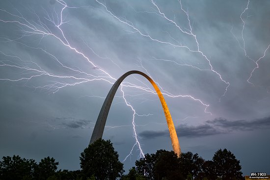 Lightning filling the sky over the Gateway Arch in St. Louis, MO during an evening storm