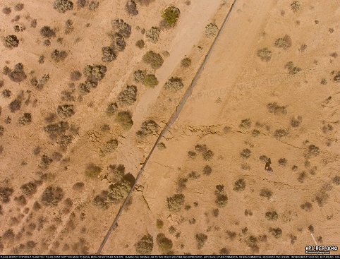 Aerial of Surface rupture fence offset from magnitude 7.1 earthquake near Ridgecrest, CA