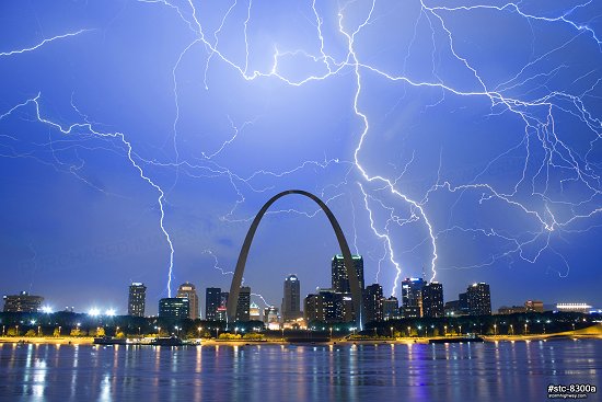 Lightning filling the sky over St. Louis and the Arch at night