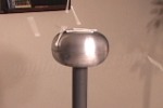 Charged cotton swabs fly off dome