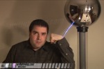 Spark jumps to demonstrator's arm